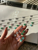 Conjunto Trevos com Zircônia Cristal e Lilás em Prata 925 Banho de Ródio Branco